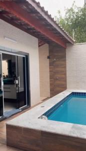Casa com piscina em praia grande piscina aquecida