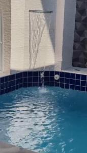Casa com piscina em praia grande piscina aquecida