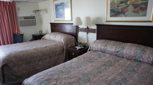 Queen Room with Two Queen Beds with Side Ocean View and Private Balcony room in Hillcrest Inn