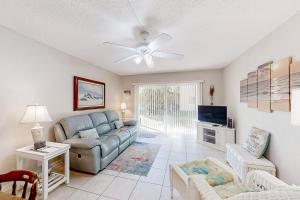 Ground-floor condo by the beach with on-site pool, tennis, & private patio