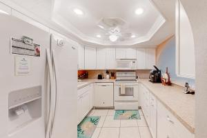 Ground-floor condo by the beach with on-site pool, tennis, & private patio