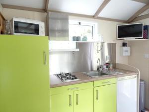 Maisons de vacances La Roulotte a 10min de Disneyland Paris - Cabane & Cabanon : photos des chambres