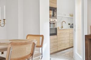 Appartements Suite luxueuse avec jardin prive Sauna et Jacuzzi : photos des chambres