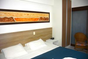 Na praia - Araça 407 Luxo - Lateral vista mar