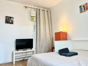 Appartements Le Kansas ~ Studio a 5 min du centre ville ~ FIBRE : photos des chambres