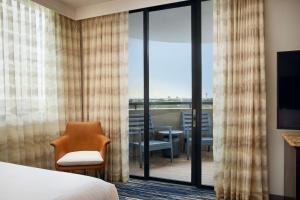 Two-Room Corner Suite with Two Queen Beds and Sleeper Sofa - Balcony room in Embassy Suites by Hilton West Palm Beach Central