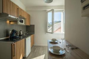 Appartements Le Jungle - Lourdes - Proche Sanctuaire : photos des chambres