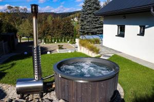 Domek Viking z prywatnym ogrzewanym basenem sauną oraz balią z jacuzzi
