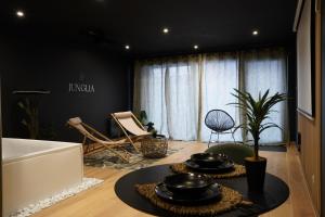 Appartements Junglia Suite - Spa & Cine : photos des chambres