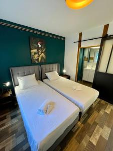 Appartements Le Dauphin - Appartement chaleureux proche Gare de Bourgoin : photos des chambres
