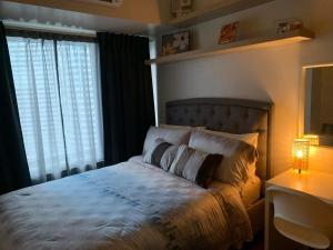 Cozy 1-BR Flat in Air Residences Makati