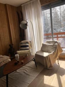 Appartement 6 personnes aux 2 Alpes, au pied des pistes - Wi-fi, Parking gratuit, Terrasse vue sur jardin
