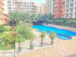 Premium 2BHK -10 min to GOI airport & beach -Pool access -Balcony with city view