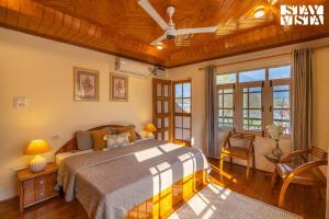 Riverfront Retreat - Qaraar by VEO, StayVista - 4BHK Villa with BBQ & Bonfire