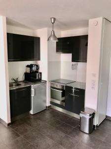 Appartements Le T2 Appartement Moderne avec Terrasse et Parking : photos des chambres