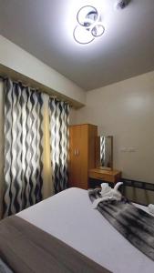 1BR with extra room at One Regis- Megaworld