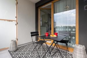 Stylish Apartment Przedpole with Balcony & Parking by Noclegi Renters