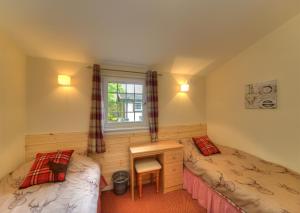 Appin Holiday Homes -Caravans, Lodges, Shepherds Hut and Train Carriage stays