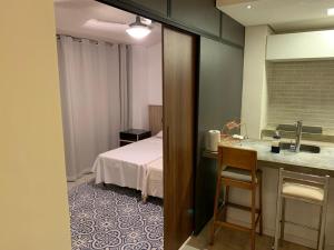 Apartamento pé na areia com piscina aquecida