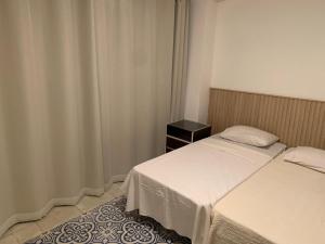 Apartamento pé na areia com piscina aquecida