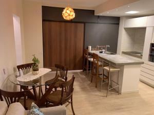 Apartamento pé na areia com piscina aquecida