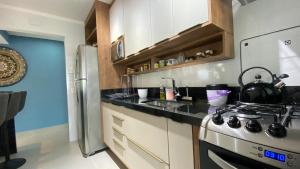 PÉ NA AREIA - SOL E MAR ENSEADA