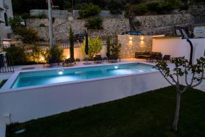 Villa Veronica with pool and boat mooring first line at sea 