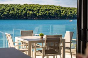 Villa Veronica with pool and boat mooring first line at sea 