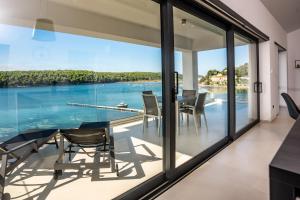 Villa Veronica with pool and boat mooring first line at sea 