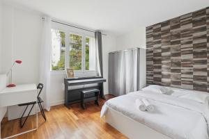Appartements Chic and spacious apartement with piano and terrace : photos des chambres