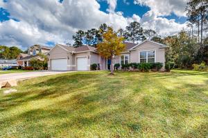 Dog-friendly home with Tesla EV charger, yard, patio, grill, AC, & WD