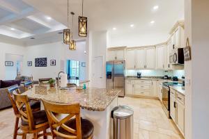 Dog-friendly home with Tesla EV charger, yard, patio, grill, AC, & WD