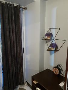 1BR with Balcony Overlooking Pool Chateau Elysee Near NAIA