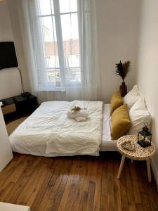 Appartements Appartement proche de PARIS au centre ville tout confort : photos des chambres