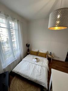Appartements Appartement proche de PARIS au centre ville tout confort : photos des chambres