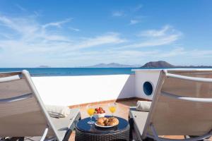 Corralejo Beachfront Villa Remos with Lobos Island View, Private Pool, Wifi & BBQ by Amazzzing Travel