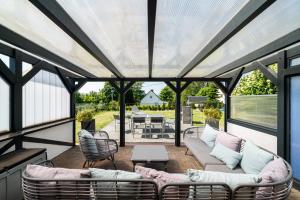 Ferienhaus Landlust - Erholung mit Fasssauna und Whirlpool nahe Binz!