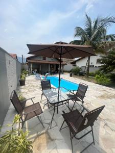 Casa para alugar em Bertioga - Piscina, Wifi e Churrasqueira