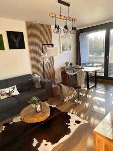 U jelena Harrachov - rodinný apartmán u lesa s garáží - 3hvězdičkové hotely ve městě Harrachov