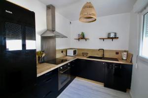 Villas Charmante maison avec piscine : photos des chambres