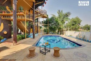 StayVista's The Revolving House - Pet-Friendly, Revolving House with Swimming Pool, Lawn & Indoor-Outdoor Games