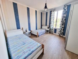 Appartements Brice Marine - T4 climatise en centre-ville : photos des chambres