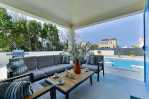 Beautiful new villa with a pool, near sandy beach, large garden - by Traveler tourist agency Krk ID 2384