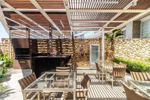 Studio moderno em condomínio de luxo pé na areia