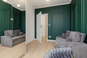 Dark Green Apartment with Furnished Garden and Parking in Warsaw by Renters