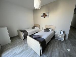 F7-3 Bedroom two single beds shared bathroom in shared Flat