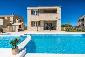New stone villa with pool near the sandy beach by Traveler tourist agency Krk ID 2372 br 1