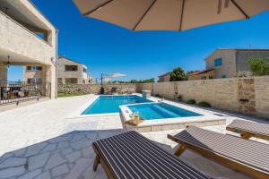 New stone villa with pool near the sandy beach by Traveler tourist agency Krk ID 2372 br 1