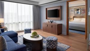 One Bedroom Executive suite with king bed and sofa bed room in The Opus Westchester Autograph Collection