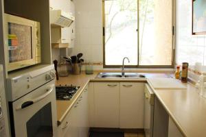 Departamento con vista al mar y jardín privado